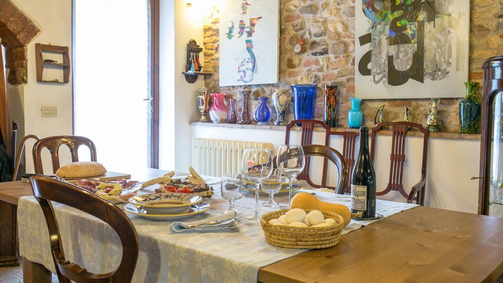 Market visit and dining experience at a local's home with cooking demo and wines in Camogli